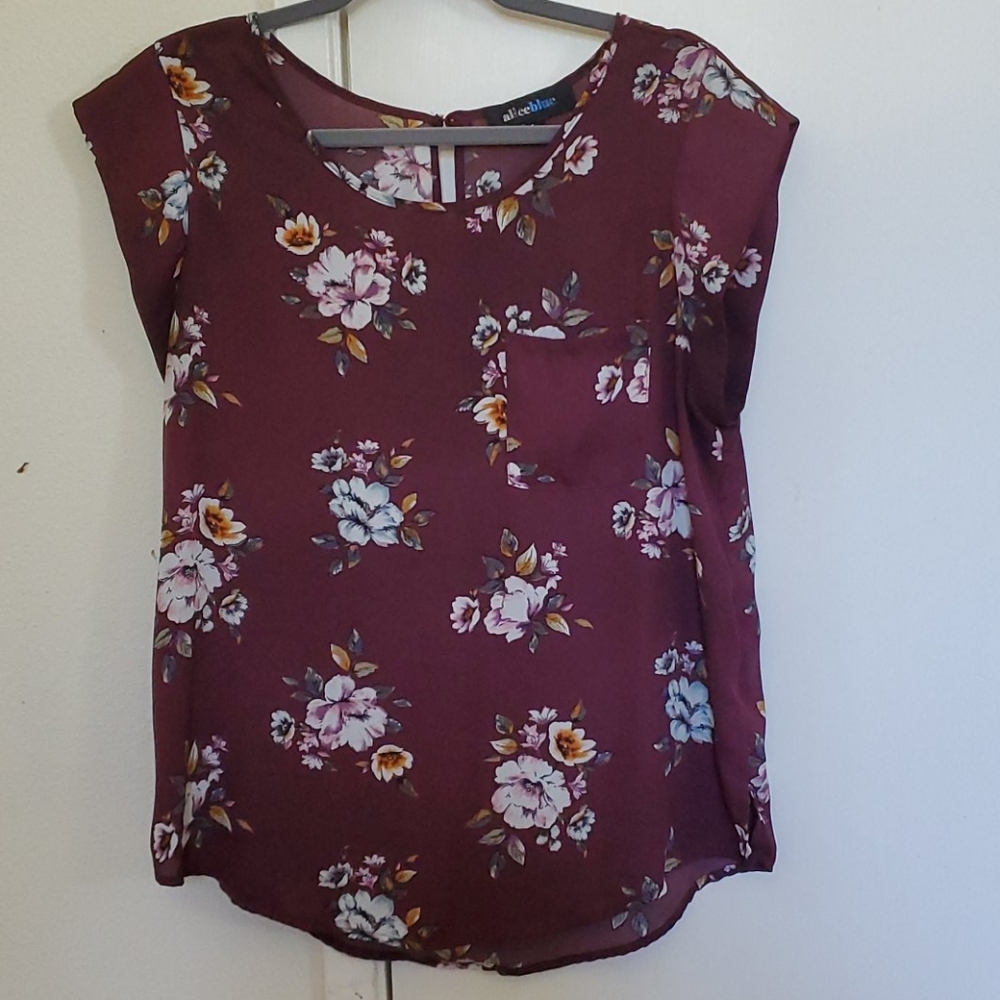 Purple floral blouse.